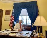 Bentz on phone at desk