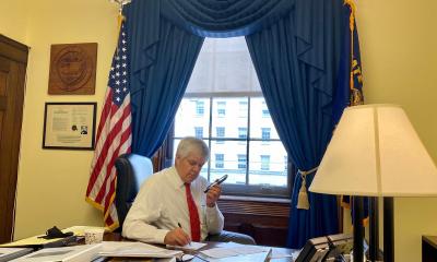 Bentz on phone at desk